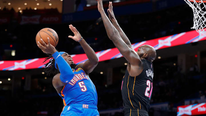 Oklahoma City Thunder forward Luguentz Dort (5) goes up for a basket as Miami Heat center Dewayne Dedmon (21) defends (Alonzo Adams-USA TODAY Sports)