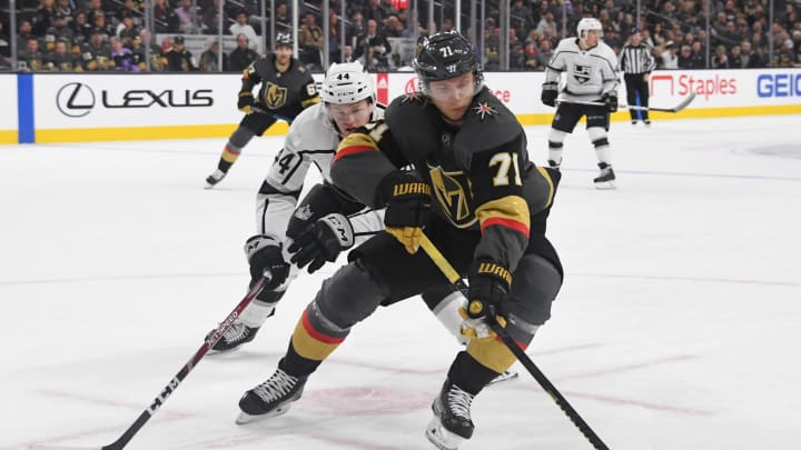 William Karlsson of the Vegas Golden Knights skates with the puck against Mikey Anderson of the Los Angeles Kings in the second period of their game at T-Mobile Arena on March 1, 2020.
