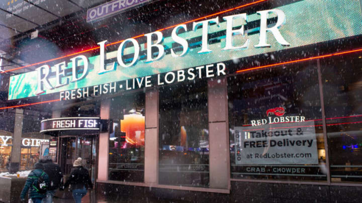 NEW YORK, NEW YORK - FEBRUARY 07: A "takeout and Free delivery" sign is displayed in the window of Red Lobster in Times Square during a snow storm on February 07, 2021 in New York City. The pandemic continues to burden restaurants and bars as businesses struggle to thrive with evolving government restrictions and social distancing plans made harder by inclement weather. (Photo by Alexi Rosenfeld/Getty Images)
