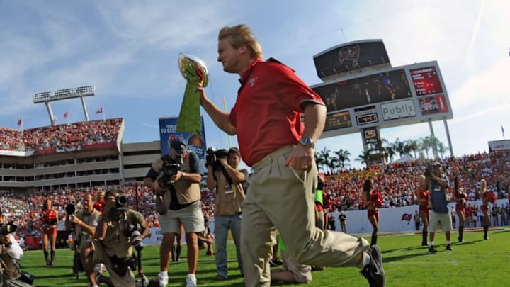 TAMPA, FL - DECEMBER 9: Former coach Jon Gruden of the Tampa Bay Buccaneers carries the Lombardi trophy to the field during half-time ceremonies as the Philadelphia Eagles play December 9, 2012 at Raymond James Stadium in Tampa, Florida. The Bucs celebrated a Super Bowl win 10 years ago. The Eagles won 23 - 21. (Photo by Al Messerschmidt/Getty Images)