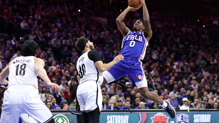 PHILADELPHIA, PENNSYLVANIA – JANUARY 25: Tyrese Maxey #0 of the Philadelphia 76ers shoots over Seth Curry #30 of the Brooklyn Nets during the second quarter at Wells Fargo Center on January 25, 2023, in Philadelphia, Pennsylvania. NOTE TO USER: User expressly acknowledges and agrees that, by downloading and or using this photograph, User is consenting to the terms and conditions of the Getty Images License Agreement. (Photo by Tim Nwachukwu/Getty Images)