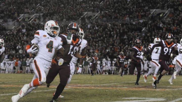 BLACKSBURG, VA - NOVEMBER 17: Wide receiver Jeff Thomas #4 of the Miami Hurricanes returns a punt for a touchdown against the Virginia Tech Hokies in the second half at Lane Stadium on November 17, 2018 in Blacksburg, Virginia. (Photo by Michael Shroyer/Getty Images)