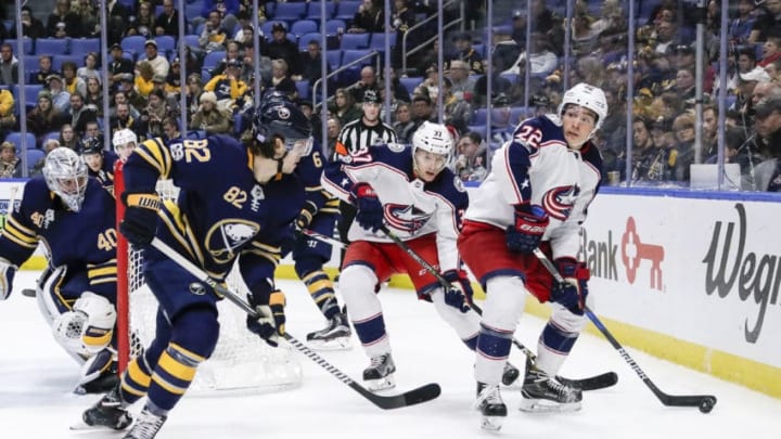 BUFFALO, NY - NOVEMBER 20: Columbus Blue Jackets Left Wing Sonny Milano (22) looks to pass as Buffalo Sabres Defenseman Nathan Beaulieu (82) defends and Columbus Blue Jackets Right Wing Markus Hannikainen (37) looks on during the Columbus Blue Jackets and Buffalo Sabres NHL game on November 20, 2017, at KeyBank Center in Buffalo, NY. (Photo by John Crouch/Icon Sportswire via Getty Images)