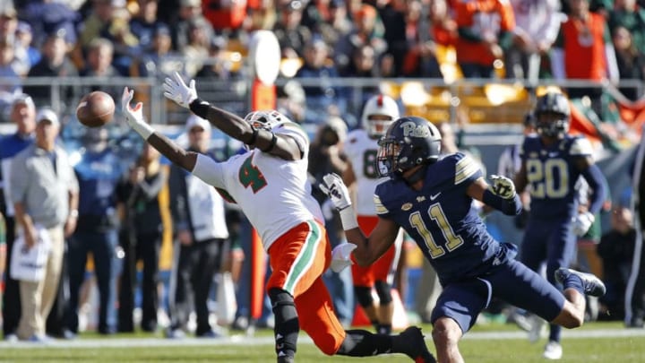 PITTSBURGH, PA - NOVEMBER 24: Jeff Thomas #4 of the Miami Hurricanes can't make the catch against Dane Jackson #11 of the Pittsburgh Panthers on November 24, 2017 at Heinz Field in Pittsburgh, Pennsylvania. (Photo by Justin K. Aller/Getty Images)