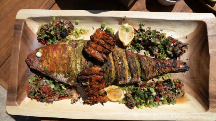 Puerto Rico - Whole queen snapper grilled with fresh vegetables. (Credit: National Geographic/Justin Mandel)