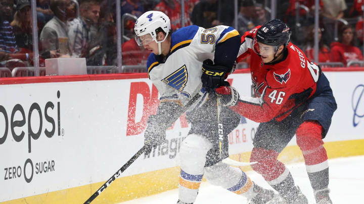 WASHINGTON, DC – SEPTEMBER 18: Austin Poganski #53 of the St. Louis Blues skates past Tobias Geisser #43 of the Washington Capitals during the first period of a preseason NHL game at Capital One Arena on September 18, 2019 in Washington, DC. (Photo by Patrick Smith/Getty Images)