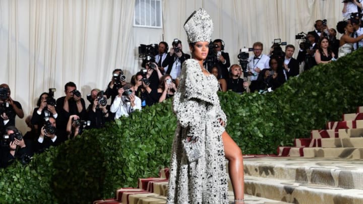 TOPSHOT - Rihanna arrives for the 2018 Met Gala on May 7, 2018, at the Metropolitan Museum of Art in New York. - The Gala raises money for the Metropolitan Museum of Arts Costume Institute. The Gala's 2018 theme is Heavenly Bodies: Fashion and the Catholic Imagination. (Photo by Hector RETAMAL / AFP) (Photo credit should read HECTOR RETAMAL/AFP/Getty Images)