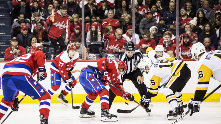 WASHINGTON, DC – DECEMBER 19: Washington Capitals center Nicklas Backstrom (19) and Pittsburgh Penguins center Riley Sheahan (15) face off during a NHL game between the Washington Capitals and the Pittsburgh Penguins on December 19, 2018, at Capital One Arena, in Washington, D.C.(Photo by Tony Quinn/Icon Sportswire via Getty Images)