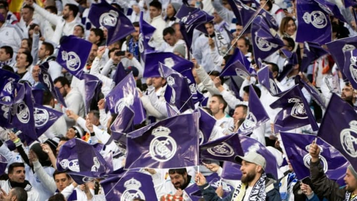 Real Madrid fans wave flags before the UEFA Champions League quarter-final second leg football match between Real Madrid CF and Juventus FC at the Santiago Bernabeu stadium in Madrid on April 11, 2018. (Photo by CURTO DE LA TORRE / AFP) (Photo credit should read CURTO DE LA TORRE/AFP/Getty Images)