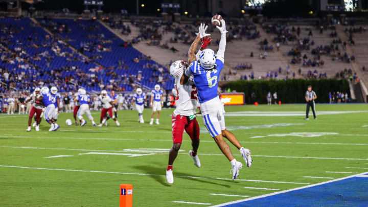 Sep 2, 2022; Durham, North Carolina, USA; Duke Blue Devils wide receiver Eli Pancol (6) jumps to catch the football while Temple Owls cornerback Iverson Clement (22) defends him during the second half of the game at Wallace Wade Stadium. Mandatory Credit: Jaylynn Nash-USA TODAY Sports
