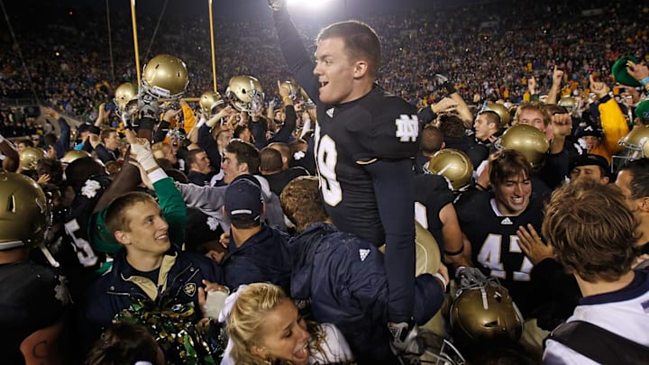 SOUTH BEND, IN – NOVEMBER 13: Ryan Sheehan #39 of the Notre Dame Fighting Irish is lifted by students while celebrating a win over the Utah Utes at Notre Dame Stadium on November 13, 2010 in South Bend, Indiana. Notre Dame defeated Utah 28-3. (Photo by Jonathan Daniel/Getty Images)