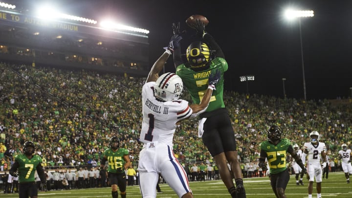 Sep 25, 2021; Eugene, Oregon, USA; Oregon Ducks cornerback Mykael Wright (2) intercepts a pass during the first half against Arizona Wildcats wide receiver Stanley Berryhill (1) at Autzen Stadium. Mandatory Credit: Troy Wayrynen-USA TODAY Sports