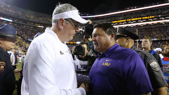BATON ROUGE, LA - OCTOBER 20: Head coach Ed Orgeron of the LSU Tigers and head coach Joe Moorhead of the Mississippi State Bulldogs talk after a game at Tiger Stadium on October 20, 2018 in Baton Rouge, Louisiana. (Photo by Jonathan Bachman/Getty Images)