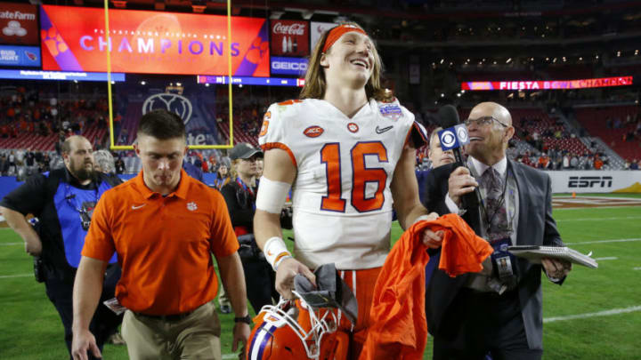 GLENDALE, ARIZONA - DECEMBER 28: Quarterback Trevor Lawrence #16 of the Clemson Tigers talks with media after his teams 29-23 victory over the Ohio State Buckeyes in the College Football Playoff Semifinal at the PlayStation Fiesta Bowl at State Farm Stadium on December 28, 2019 in Glendale, Arizona. (Photo by Ralph Freso/Getty Images)