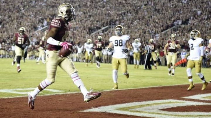 Oct 18, 2014; Tallahassee, FL, USA; Florida State Seminoles wide receiver Travis Rudolph (15) walks into the end zone for a touchdown against the Notre Dame Fighting Irish during the first quarter at Doak Campbell Stadium. Mandatory Credit: John David Mercer-USA TODAY Sports Oct 18, 2014; Tallahassee, FL, USA; Florida State Seminoles wide receiver Travis Rudolph (15) walks into the end zone for a touchdown against the Notre Dame Fighting Irish during the first quarter at Doak Campbell Stadium. Mandatory Credit: John David Mercer-USA TODAY Sports
