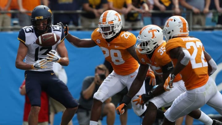 CHARLOTTE, NC - SEPTEMBER 01: The defense of the Tennessee Volunteers watch as David Sills V #13 of the West Virginia Mountaineers drops a pass in the endzone during their game at Bank of America Stadium on September 1, 2018 in Charlotte, North Carolina. (Photo by Streeter Lecka/Getty Images)