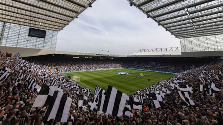 NEWCASTLE UPON TYNE, ENGLAND - APRIL 17: Newcastle United fans wave flags bbefore the Premier League match between Newcastle United and Leicester City at St. James Park on April 17, 2022 in Newcastle upon Tyne, England. (Photo by Visionhaus/Getty Images)