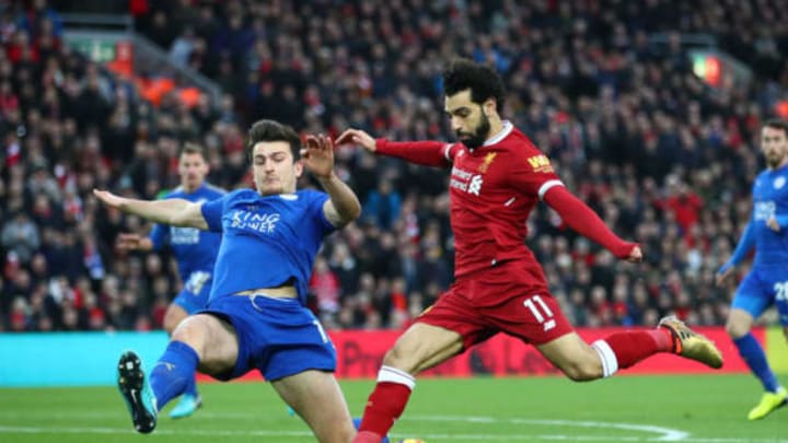 Mohamed Salah of Liverpool is challenged by Harry Maguire of Leicester City during the Premier League match between Liverpool and Leicester City at Anfield. (Photo by Clive Brunskill/Getty Images)