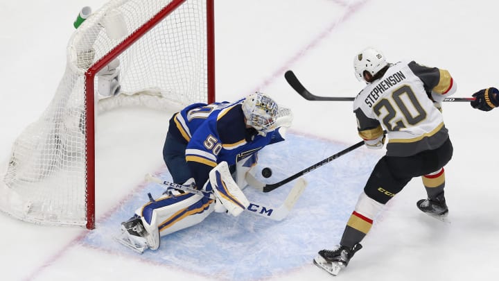 Jordan Binnington #50 of the St. Louis Blues stops a shot against Chandler Stephenson #20 of the Vegas Golden Knights during the first period in a Western Conference Round Robin.