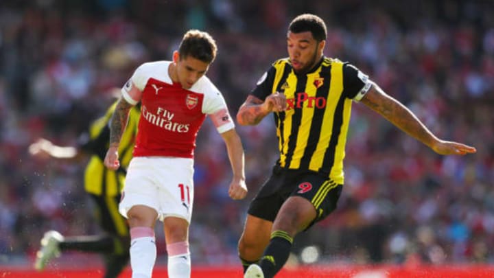 LONDON, ENGLAND – SEPTEMBER 29: Lucas Torreira of Arsenal is challenged by Troy Deeney (R) of Watford during the Premier League match between Arsenal FC and Watford FC at Emirates Stadium on September 29, 2018 in London, United Kingdom. (Photo by Catherine Ivill/Getty Images)
