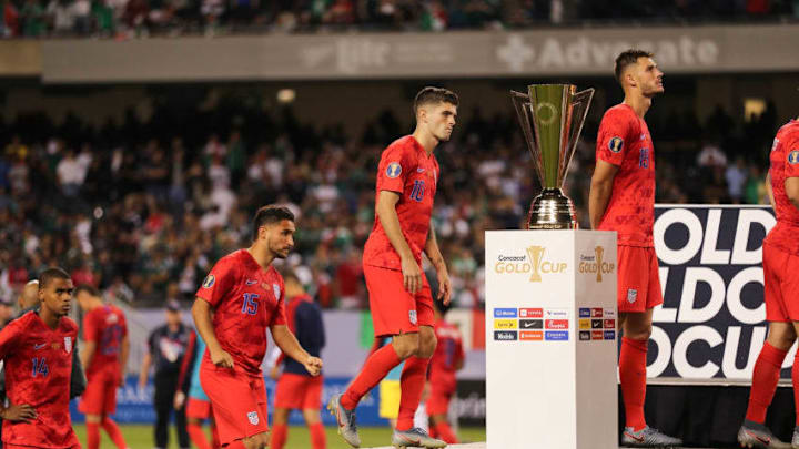 CHICAGO, IL - JULY 07: Christian Pulisic of USA walks past the CONCACAF Gold Cup trophy after USA's 0-1 defeat to Mexico in the 2019 CONCACAF Gold Cup Final between Mexico and United States of America at Soldier Field on July 7, 2019 in Chicago, Illinois. (Photo by Matthew Ashton - AMA/Getty Images)