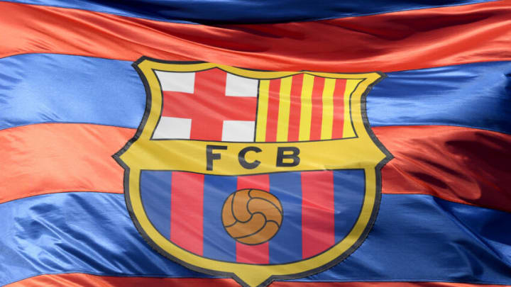 BARCELONA, SPAIN - APRIL 04: The Barcelona logo is seen on a flag waving above the stadium prior to the UEFA Champions League Quarter Final Leg One match between FC Barcelona and AS Roma at Camp Nou on April 4, 2018 in Barcelona, Spain. (Photo by Mike Hewitt/Getty Images)