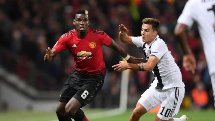 MANCHESTER, ENGLAND - OCTOBER 23: Paul Pogba of Manchester United holds off Paulo Dybala of Juventus during the Group H match of the UEFA Champions League between Manchester United and Juventus at Old Trafford on October 23, 2018 in Manchester, United Kingdom. (Photo by Laurence Griffiths/Getty Images)