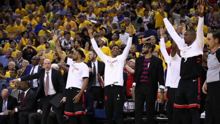 OAKLAND, CALIFORNIA - JUNE 05: The Toronto Raptors bench celebrates a basket against the Golden State Warriors in the second half during Game Three of the 2019 NBA Finals at ORACLE Arena on June 05, 2019 in Oakland, California. NOTE TO USER: User expressly acknowledges and agrees that, by downloading and or using this photograph, User is consenting to the terms and conditions of the Getty Images License Agreement. (Photo by Ezra Shaw/Getty Images)