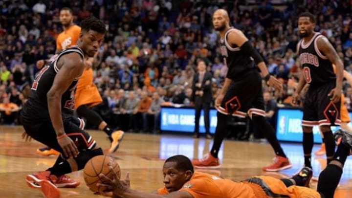 Jan 30, 2015; Phoenix, AZ, USA; Phoenix Suns guard Eric Bledsoe dives with the basketball against Chicago Bulls guard Jimmy Butler (21) in the second half at US Airways Center. The Suns won 99-93. Mandatory Credit: Jennifer Stewart-USA TODAY Sports