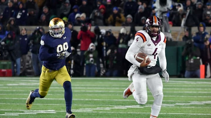 Nov 19, 2016; South Bend, IN, USA; Virginia Tech Hokies quarterback Jerod Evans (4) runs the ball as Notre Dame Fighting Irish defensive lineman Andrew Trumbetti (98) pursues in the fourth quarter at Notre Dame Stadium. Virginia Tech won 34-31. Mandatory Credit: Matt Cashore-USA TODAY Sports