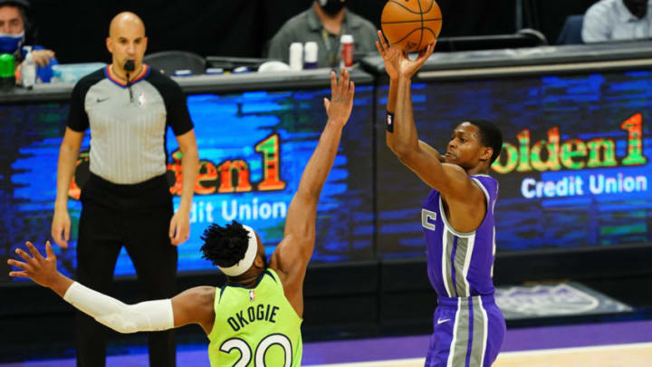 SACRAMENTO, CALIFORNIA - APRIL 20: De'Aaron Fox #5 of the Sacramento Kings shoots a three-pointer over Josh Okogie #20 of the Minnesota Timberwolves at Golden 1 Center on April 20, 2021 in Sacramento, California. NOTE TO USER: User expressly acknowledges and agrees that, by downloading and or using this photograph, User is consenting to the terms and conditions of the Getty Images License Agreement. (Photo by Daniel Shirey/Getty Images)