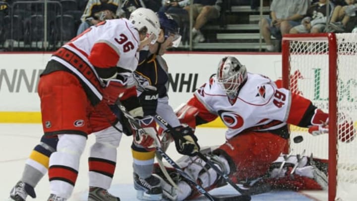 NASHVILLE, TN – SEPTEMBER 26: Forward J.P.Dumont of the Nashville Predators skates through the defense of forward Jussi Jokinen #36 of the Carolina Hurricanes and scores a goal against Hurricanes goalie Michael Leighton #49 during a pre-season NHL game at the Sommet Center on September 26, 2009 in Nashville, Tennessee. (Photo by Frederick Breedon/Getty Images)