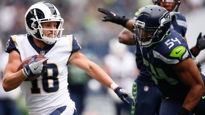 SEATTLE, WA – OCTOBER 07: Wide Receiver Cooper Kupp #18 of the Los Angeles Rams avoids a tackle by Linebacker Bobby Wagner #54 in the first half at CenturyLink Field on October 7, 2018 in Seattle, Washington. (Photo by Otto Greule Jr/Getty Images)