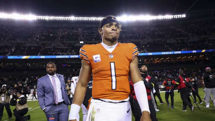CHICAGO, IL - OCTOBER 13: Justin Fields #1 of the Chicago Bears walks off the field dejected after an NFL football game against the Washington Commanders at Soldier Field on October 13, 2022 in Chicago, Illinois. (Photo by Kevin Sabitus/Getty Images)