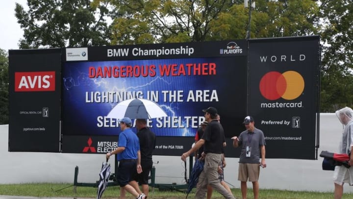 Sep 8, 2016; Carmel, IN, USA; Fans on the 18th hole head towards the exits in a rain delay due to inclement weather during the first round of the BMW Championship at Crooked Stick GC. Mandatory Credit: Brian Spurlock-USA TODAY Sports