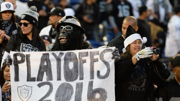Dec 18, 2016; San Diego, CA, USA; An Oakland Raiders fan holds a sign after the Raiders beat the San Diego Chargers 19-16 at Qualcomm Stadium. Mandatory Credit: Jake Roth-USA TODAY Sports