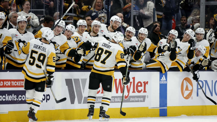 COLUMBUS, OHIO – NOVEMBER 14: Sidney Crosby #87 of the Pittsburgh Penguins is congratulated by his teammates after scoring his third goal of the game and recording a hat-trick during the third period against the Columbus Blue Jackets at Nationwide Arena on November 14, 2023 in Columbus, Ohio. Pittsburgh defeated Columbus 5-3. (Photo by Kirk Irwin/Getty Images)