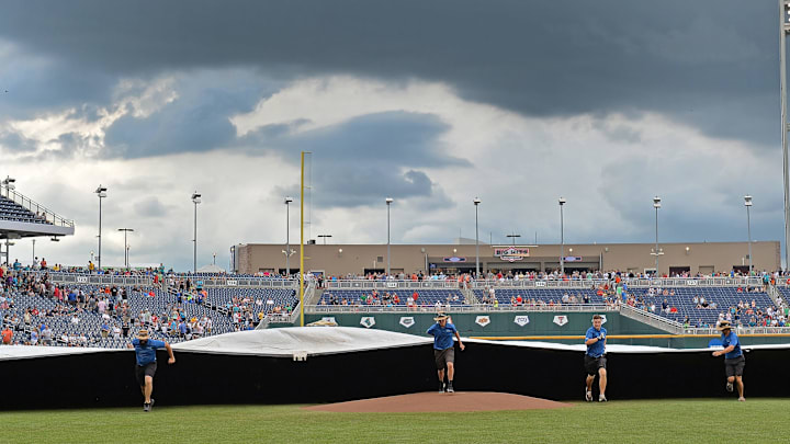 Omaha, NE – JUNE 29: The field crew runs out the tarp, with game three of the College World Series Championship Series between the Arizona Wildcats and the Coastal Carolina Chanticleers is under a weather delay on June 29, 2016 at TD Ameritrade Park in Omaha, Nebraska. (Photo by Peter Aiken/Getty Images)