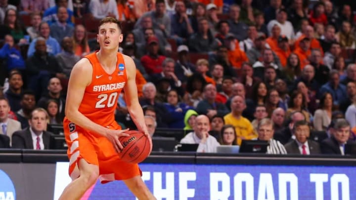 Mar 27, 2016; Chicago, IL, USA; Syracuse Orange forward Tyler Lydon (20) shoots the ball after losing his shoe against the Virginia Cavaliers during the first half in the championship game of the midwest regional of the NCAA Tournament at the United Center. Mandatory Credit: Dennis Wierzbicki-USA TODAY Sports