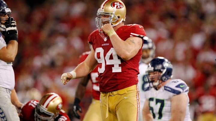 SAN FRANCISCO, CA - OCTOBER 18: Defensive tackle Justin Smith #94 of the San Francisco 49ers reacts after disrupting the Seattle Seahawks offense in the fourth quarter on October 18, 2012 at Candlestick Park in San Francisco, California. The 49ers won 13-6. (Photo by Brian Bahr/Getty Images)