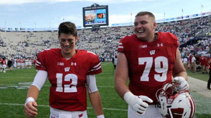 PROVO, UT – SEPTEMBER 16: Quarterback Alex Hornibrook #12 of the Wisconsin Badgers and teammate David Edwards #79 walk off the field after their 40-6 win over the Brigham Young Cougars at LaVell Edwards Stadium on September 16, 2017 in Provo, Utah. (Photo by Gene Sweeney Jr/Getty Images)