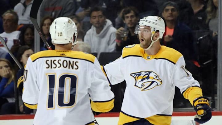 NEW YORK, NY - OCTOBER 06: Mattias Ekholm #14 of the Nashville Predators (r) celebrates his goal at 16:46 of the first period against the New York Islanders and is joined by Colton Sissons #10 (l) at the Barclays Center on October 06, 2018 in the Brooklyn borough of New York City. (Photo by Bruce Bennett/Getty Images)