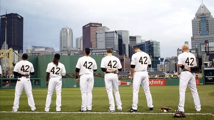 April 15, 2013; Pittsburgh, PA, USA; Pittsburgh Pirates players wearing number 42 in commemeration of Jackie Robinson Day in Major League Baseball stand for the national anthem before playing the St. Louis Cardinals at PNC Park. Mandatory Credit: Charles LeClaire-USA TODAY Sports