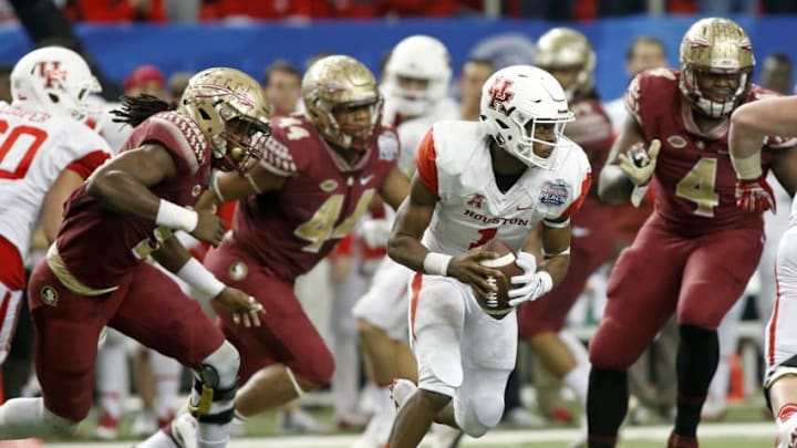 Dec 31, 2015; Atlanta, GA, USA; Houston Cougars quarterback Greg Ward Jr. (1) runs with the ball against the Florida State Seminoles in the third quarter of the 2015 Chick-fil-A Peach Bowl at the Georgia Dome. The Cougars won 38-24. Mandatory Credit: Jason Getz-USA TODAY Sports