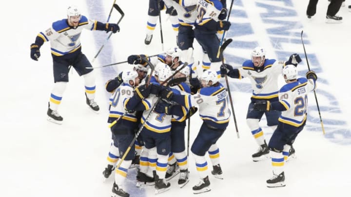BOSTON, MA - MAY 29: St. Louis celebrates their first ever Finals win courtesy of St. Louis Blues defenseman Carl Gunnarsson (4) in overtime during Game 2 of the 2019 Stanley Cup Finals between the Boston Bruins and the St. Louis Blues on May 29, 2019, at TD Garden in Boston, Massachusetts. (Photo by Fred Kfoury III/Icon Sportswire via Getty Images)