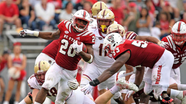 RALEIGH, NC – OCTOBER 06: Ricky Person Jr. #20 of the North Carolina State Wolfpack breaks away from Mike Palmer #18 of the Boston College Eagles during their game at Carter-Finley Stadium on October 6, 2018 in Raleigh, North Carolina. North Carolina State won 28-23. (Photo by Grant Halverson/Getty Images)