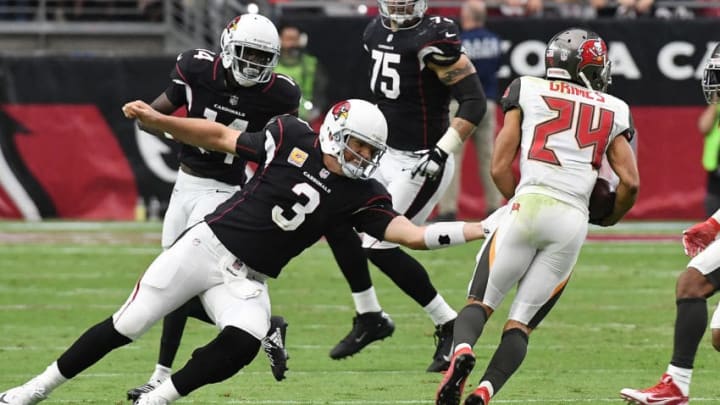 GLENDALE, AZ - OCTOBER 15: Carson Palmer #3 of the Arizona Cardinals attempts to tackle Brent Grimes #24 of the Tampa Bay Buccaneers who picked off a pass during the fourth quarter at University of Phoenix Stadium on October 15, 2017 in Glendale, Arizona. Cardinals won 38-33. (Photo by Norm Hall/Getty Images)