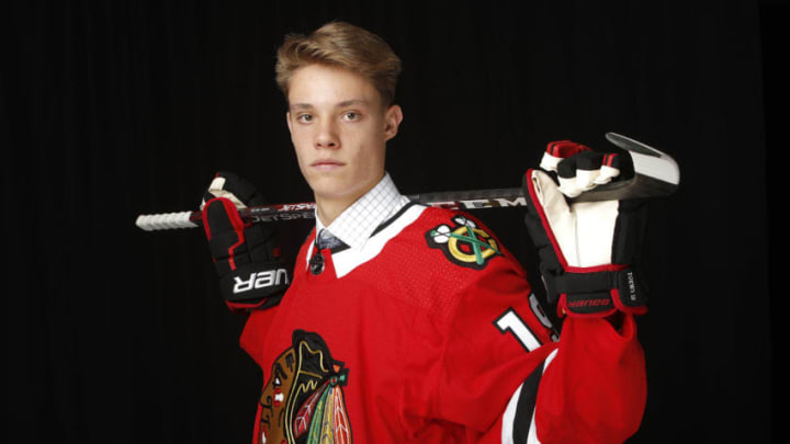 VANCOUVER, BRITISH COLUMBIA - JUNE 22: Alex Vlasic reacts after being selected 43rd overall by the Chicago Blackhawks during the 2019 NHL Draft at Rogers Arena on June 22, 2019 in Vancouver, Canada. (Photo by Kevin Light/Getty Images)