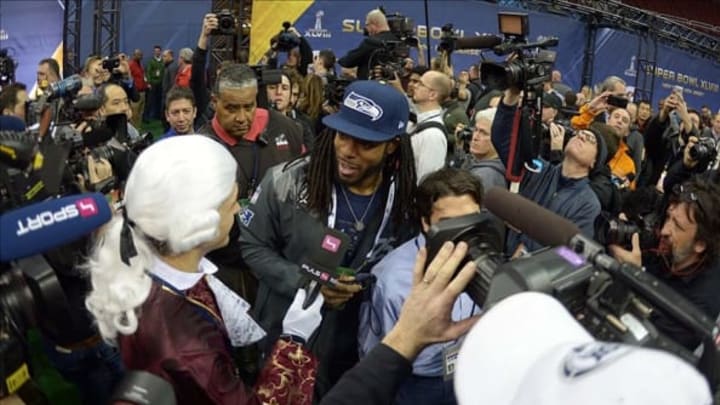 Jan 28, 2014; Newark, NJ, USA; Seattle Seahawks cornerback Richard Sherman is interviewed by Hajsan of Austrian TV during Media Day for Super Bowl XLIII at Prudential Center. Mandatory Credit: Kirby Lee-USA TODAY Sports