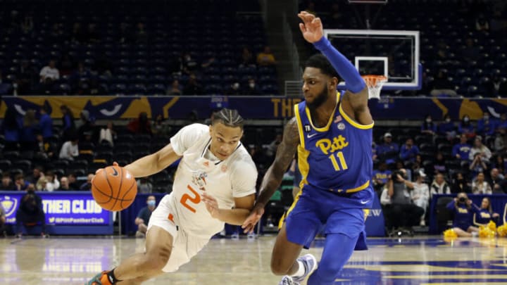 Feb 22, 2022; Pittsburgh, Pennsylvania, USA; Miami (Fl) Hurricanes guard Isaiah Wong (2) drives to the basket against Pittsburgh Panthers guard Jamarius Burton (11) during the second half at the Petersen Events Center. Miami won 85-64. Mandatory Credit: Charles LeClaire-USA TODAY Sports